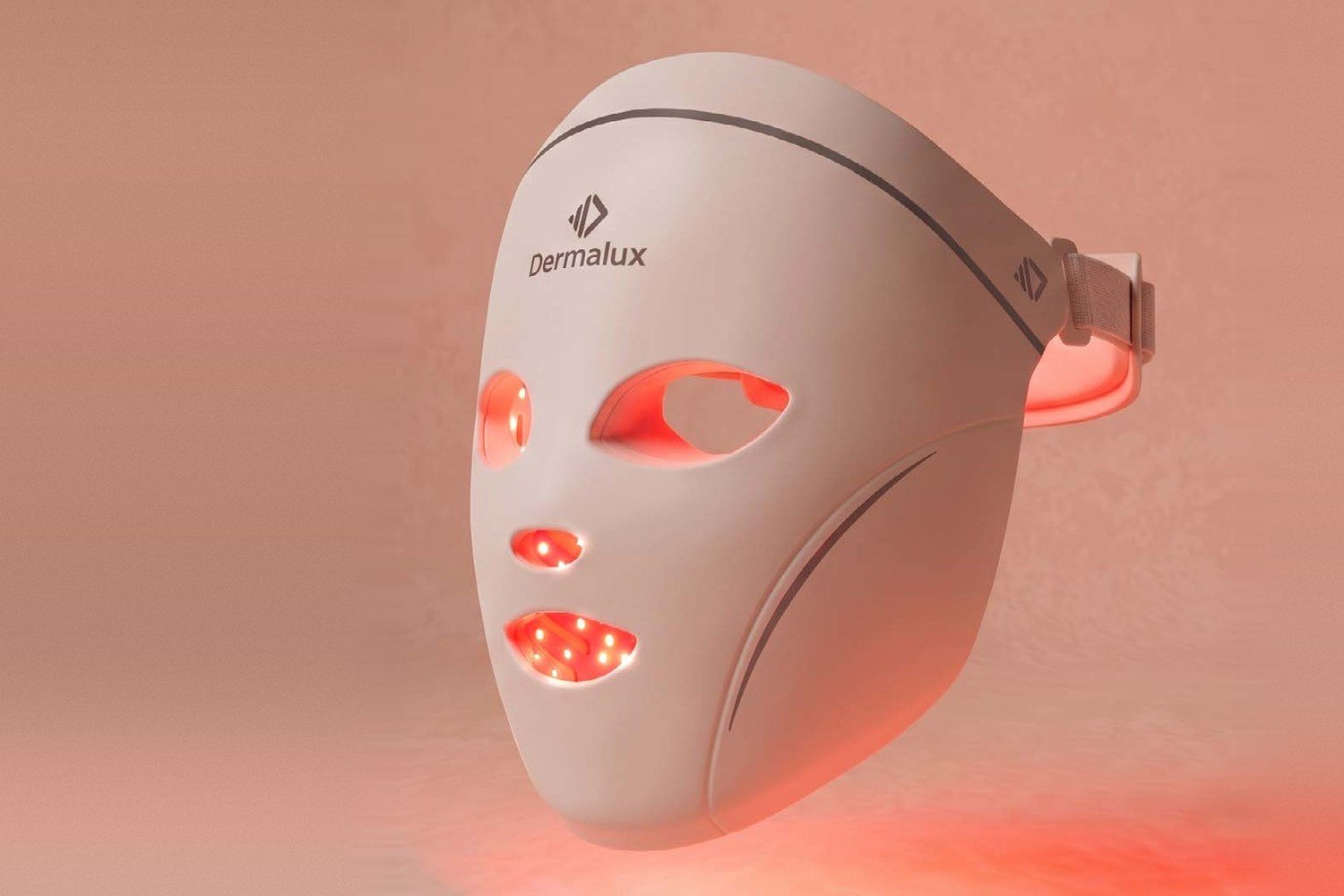 Dermalux LED Face Mask glowing red on a soft pink background